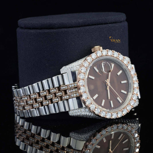 Rose gold and silver-toned iced-out watch with a brown dial a diamond encrusted bezel and a link band by swandiamond